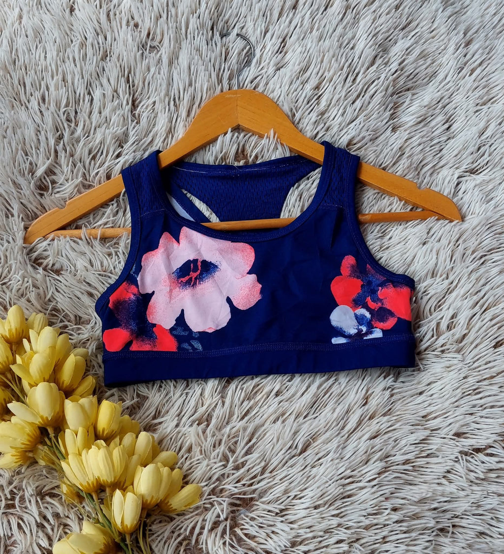 TOP MORADO CON FLORES DOBLE TIRANTE EN LA PARTE DE ATRÁS